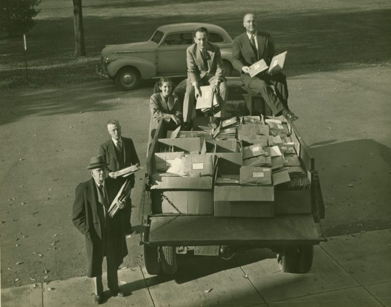 Gordon Fister, Haps Benfer, Robert Horn, and others with truckload of stationary gifts for servicement.